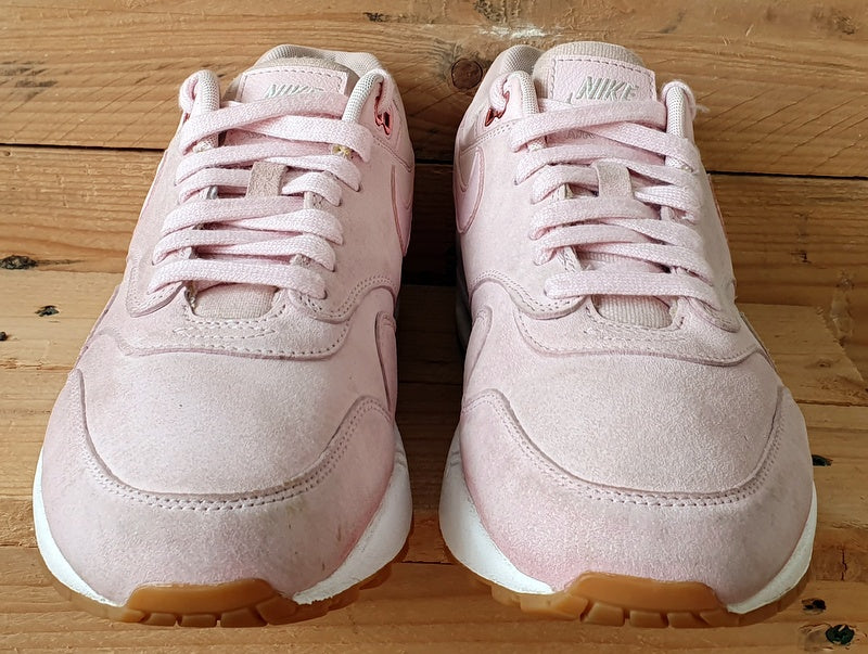 Pink suede nike trainers best sale